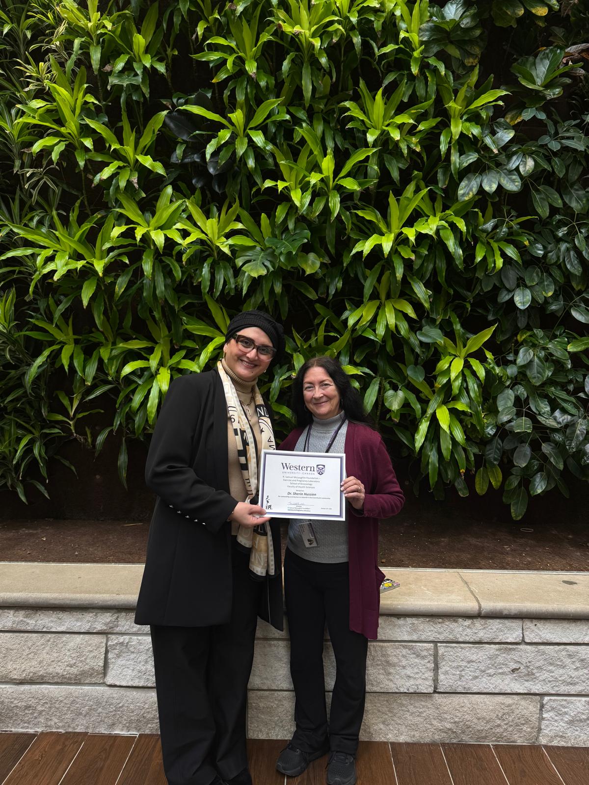 Dr. Sherin Hussien receiving recognition